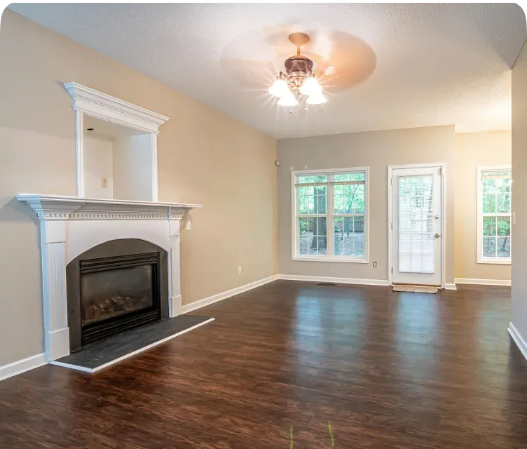 Renovated living space with new flooring and lighting