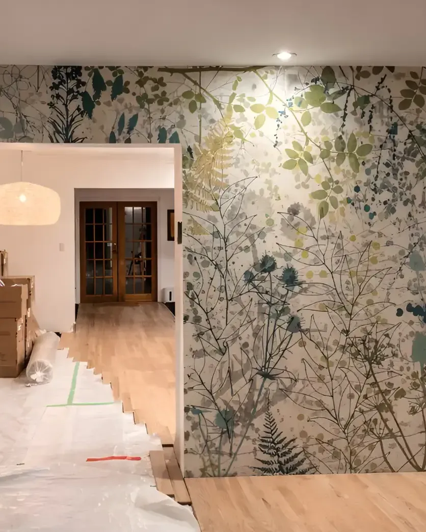 Botanical feature wall freshly installed beside a doorway, floor protection still down