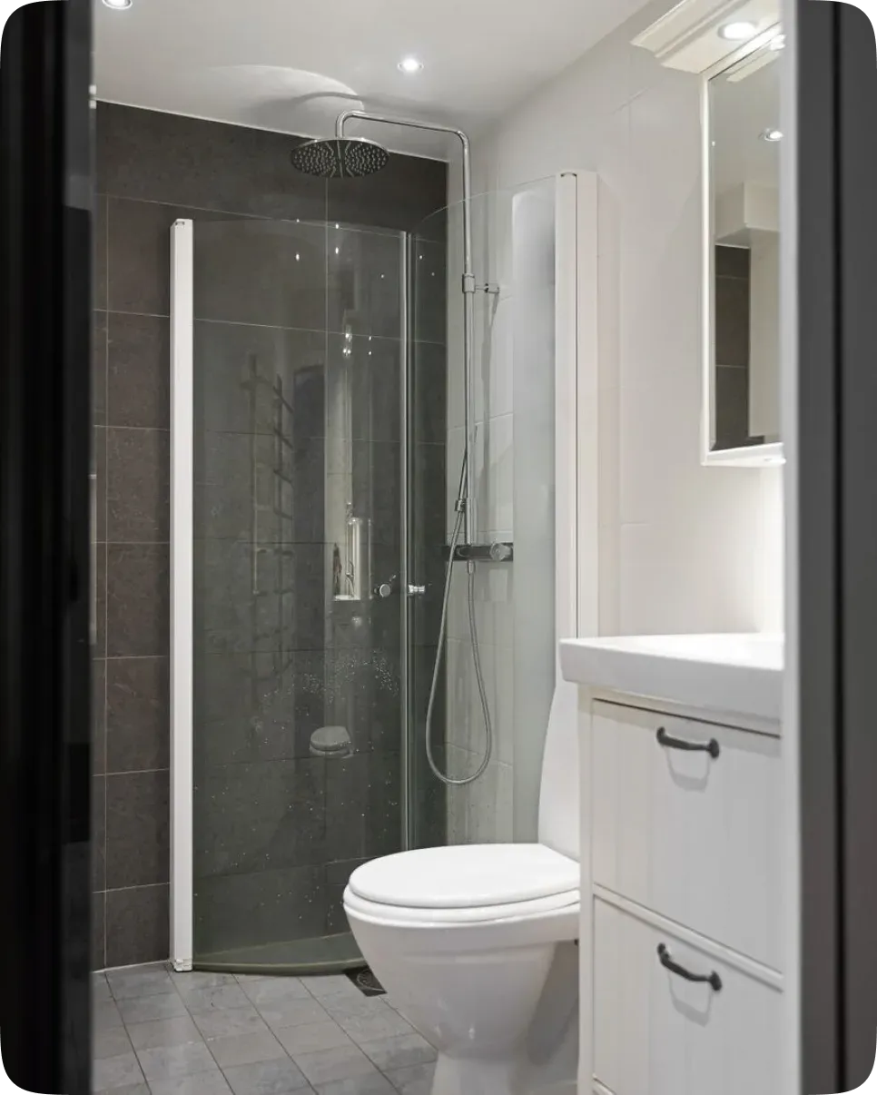 Renovated bathroom with a walk-in shower and modern tile finishes