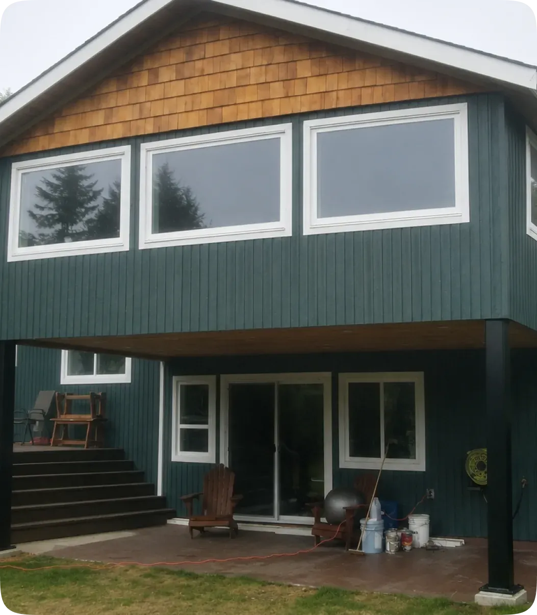 Renovated home exterior with a new deck and outdoor living space