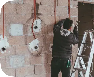 Electrician coordinating wiring as part of a renovation