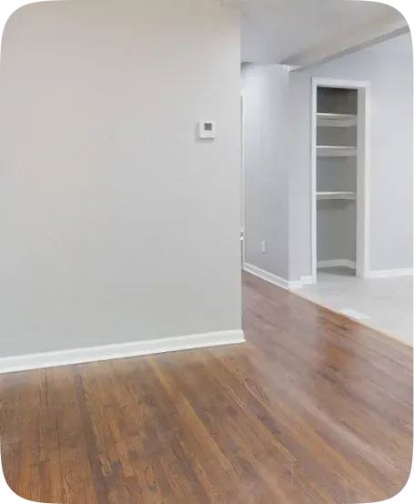 Empty room with freshly painted light grey walls and trim