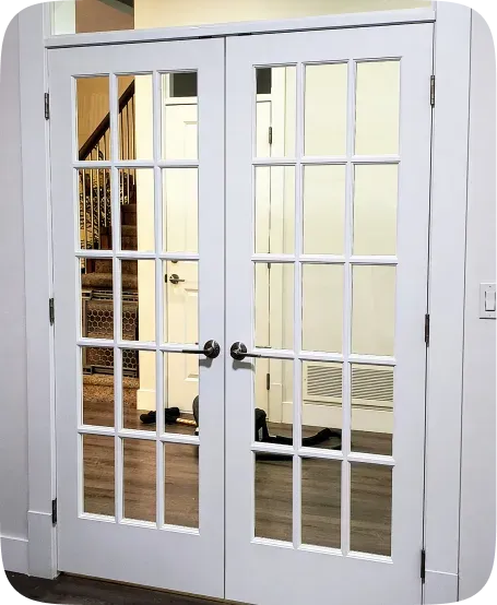 White panelled French doors with a smooth painted finish