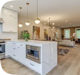 Open-concept kitchen connected to a living area, renovated by PCC